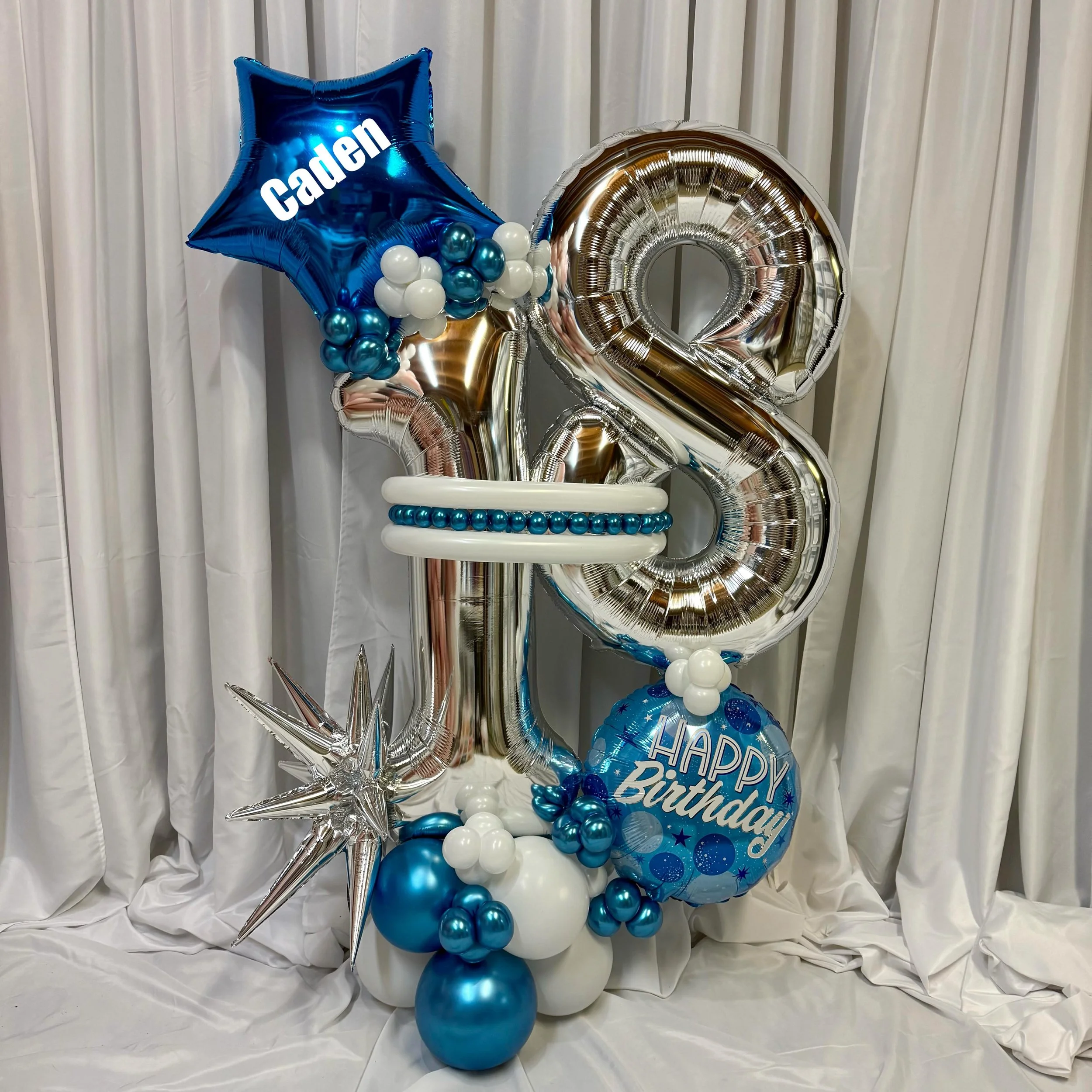 Happy 18th Birthday Caden!

This 18th birthday balloon bouquet is all about celebrating the big day in style- bold metallic blue and silver tones, personalized star details and a whole lot of impact!

We continue to spread joy throughout the greater 
