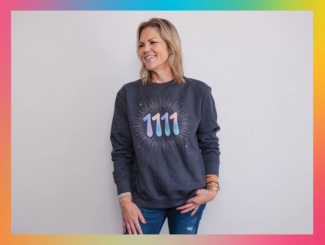 Angel Numbers - sometimes we need a reminder that we are divinely guided. Image of Kelly (woman) wearing a sweatshirt that says: 1111.