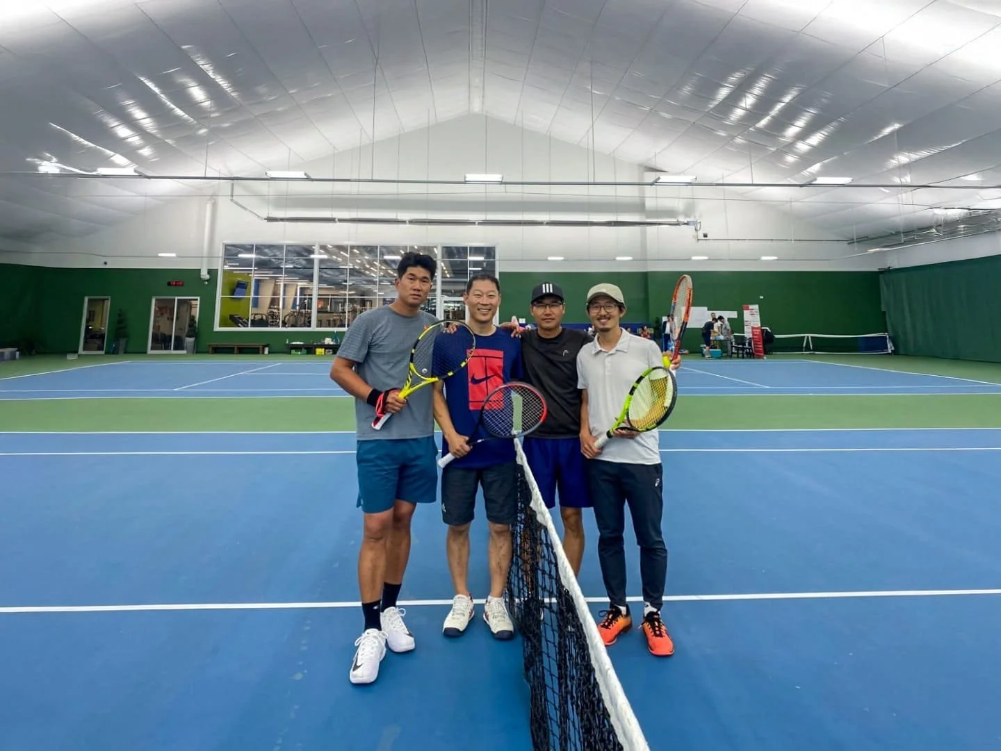 toronto tennis players holding rackets and smiling