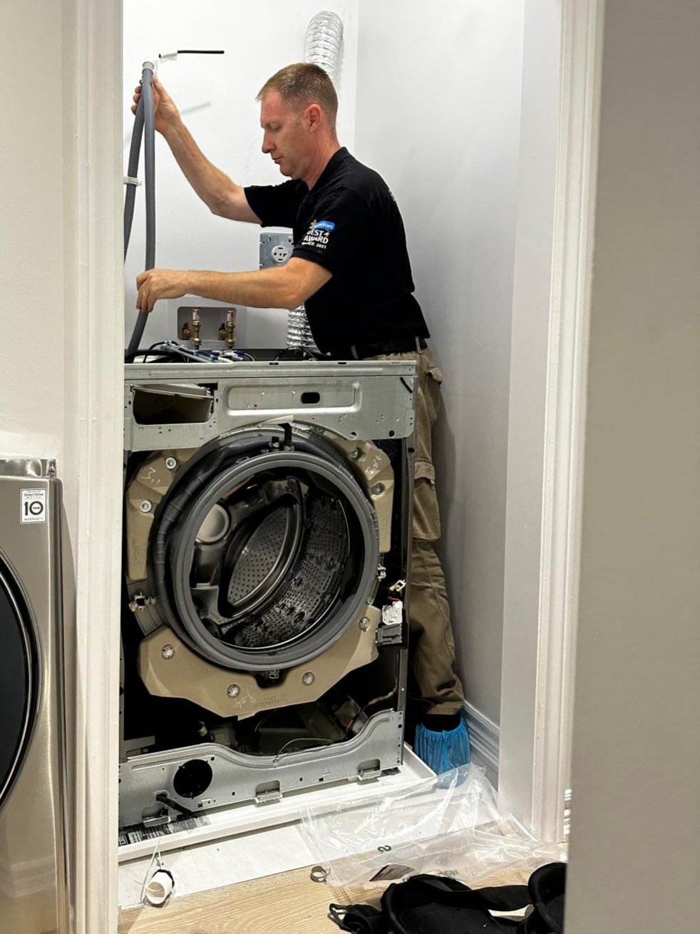 Best Appliance Repair Tech Fixing a Dryer