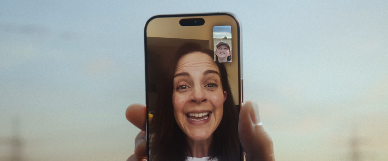 SHOT 23
Evening: Maggie FaceTimes a grown child. She aims the phone at Milo for a moment; child and mother smile.
