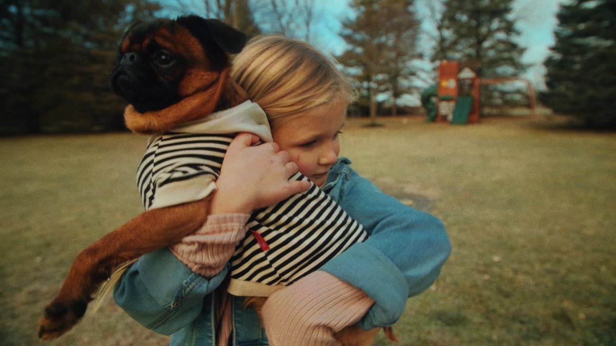 SHOT 13
Child hugs Charlie after meal.