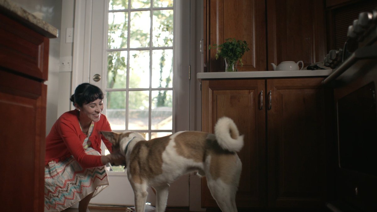 SHOT 26
Maggie pets Milo. He remains still.