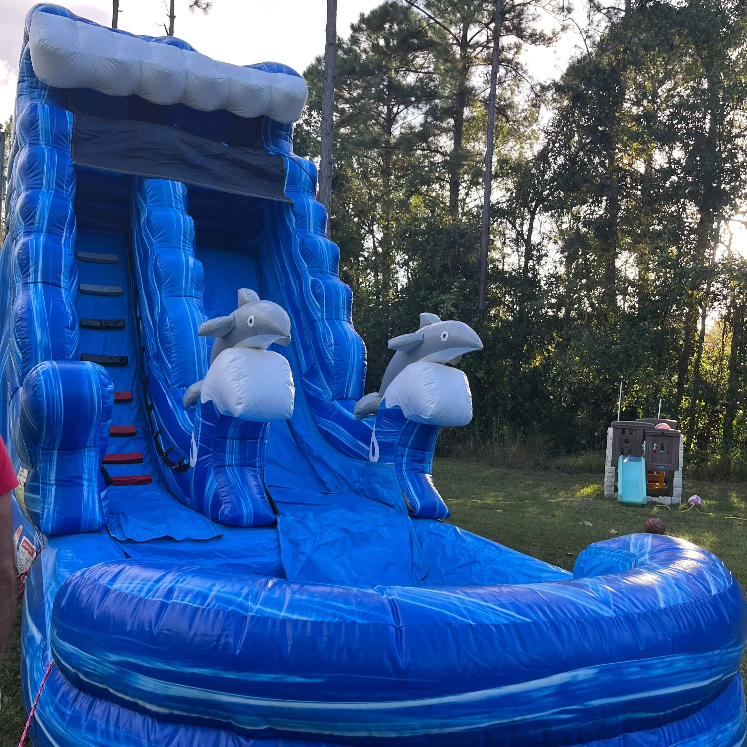 18-foot Big Flipper water slide delivering fast rides and nonstop summer fun for birthday parties.