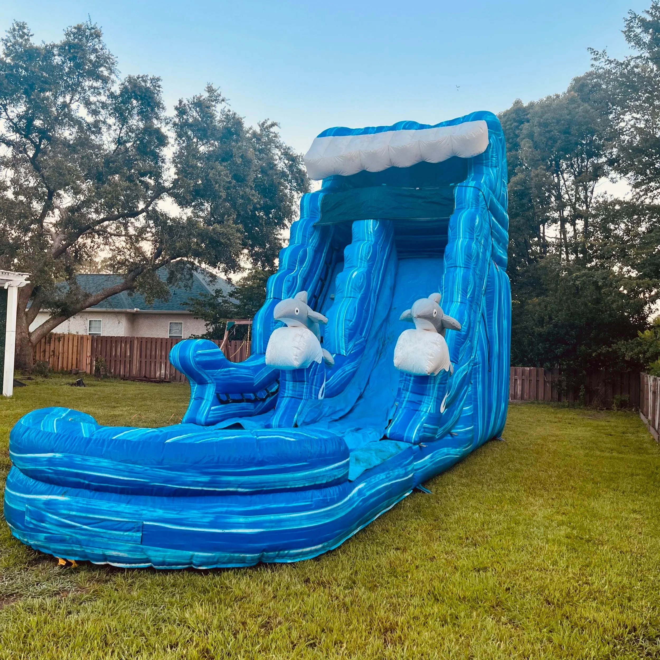 Big Flipper inflatable water slide rental from Bounce Brunswick, perfect for kids, teens, and adults.