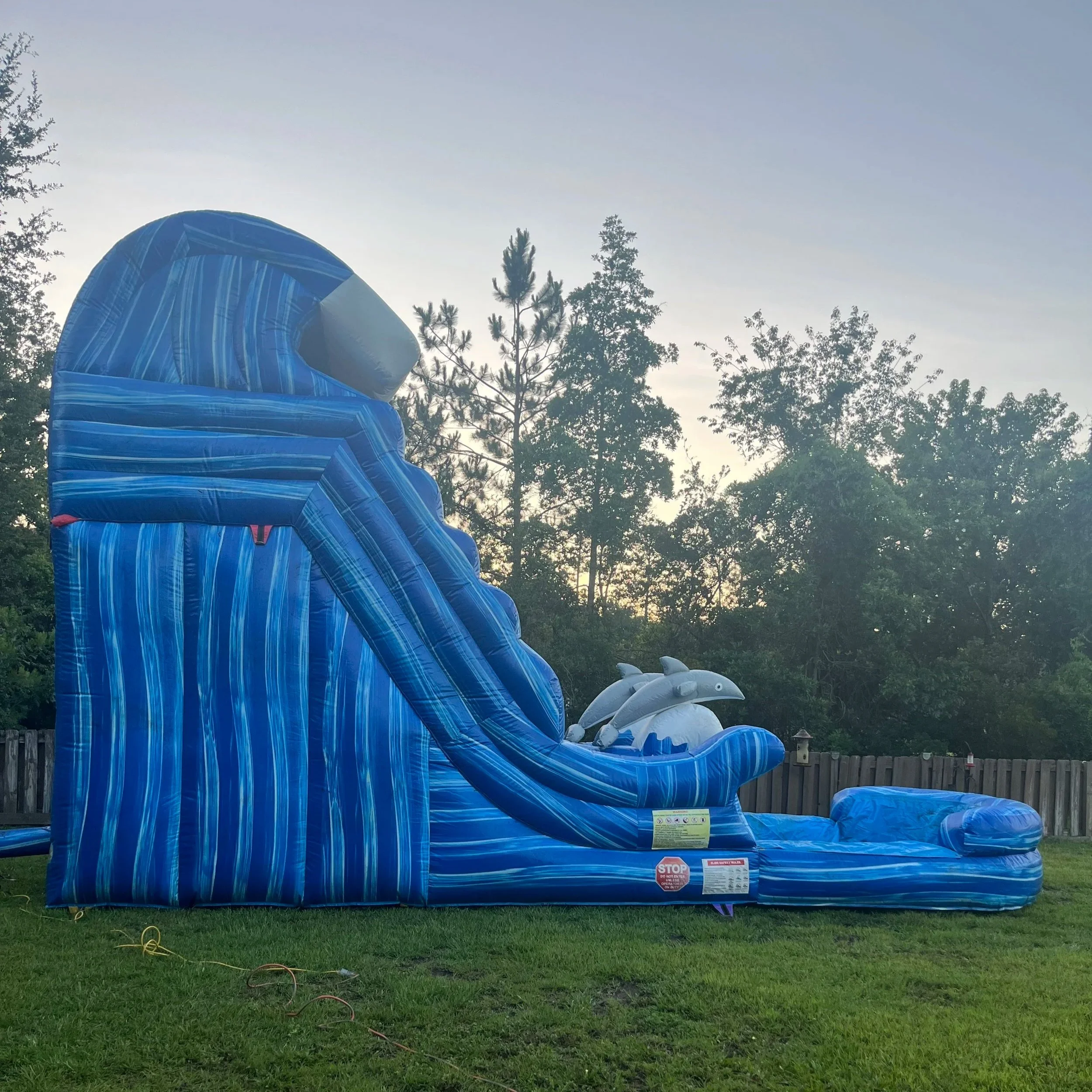 Backyard setup of the Big Flipper waterslide in Coastal Georgia with a compact footprint.