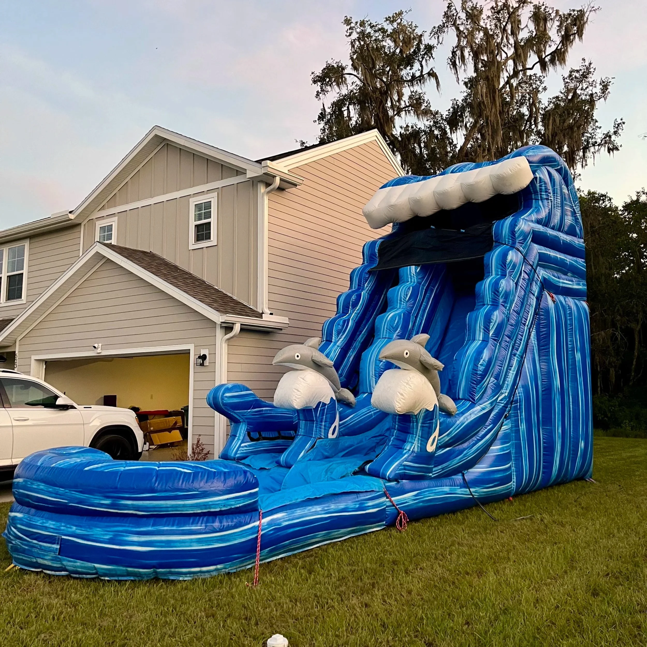 Big Flipper inflatable waterslide with single-lane design, ideal for residential yard setups.