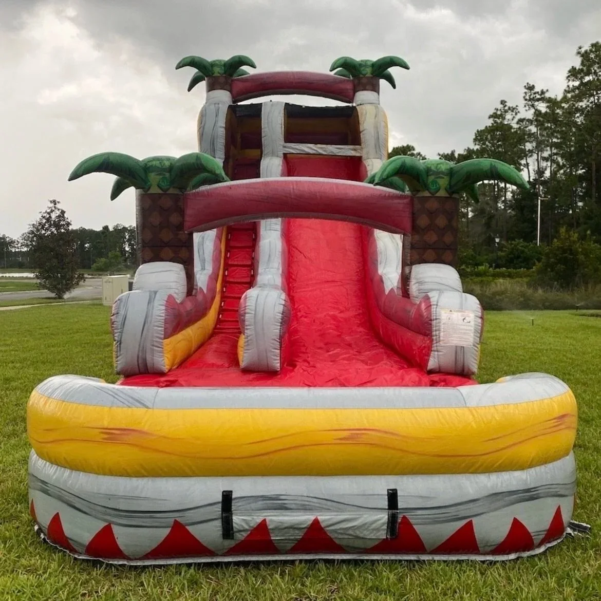 Backyard Fire & Ice water slide set up on grass for a summer birthday party in Coastal Georgia.