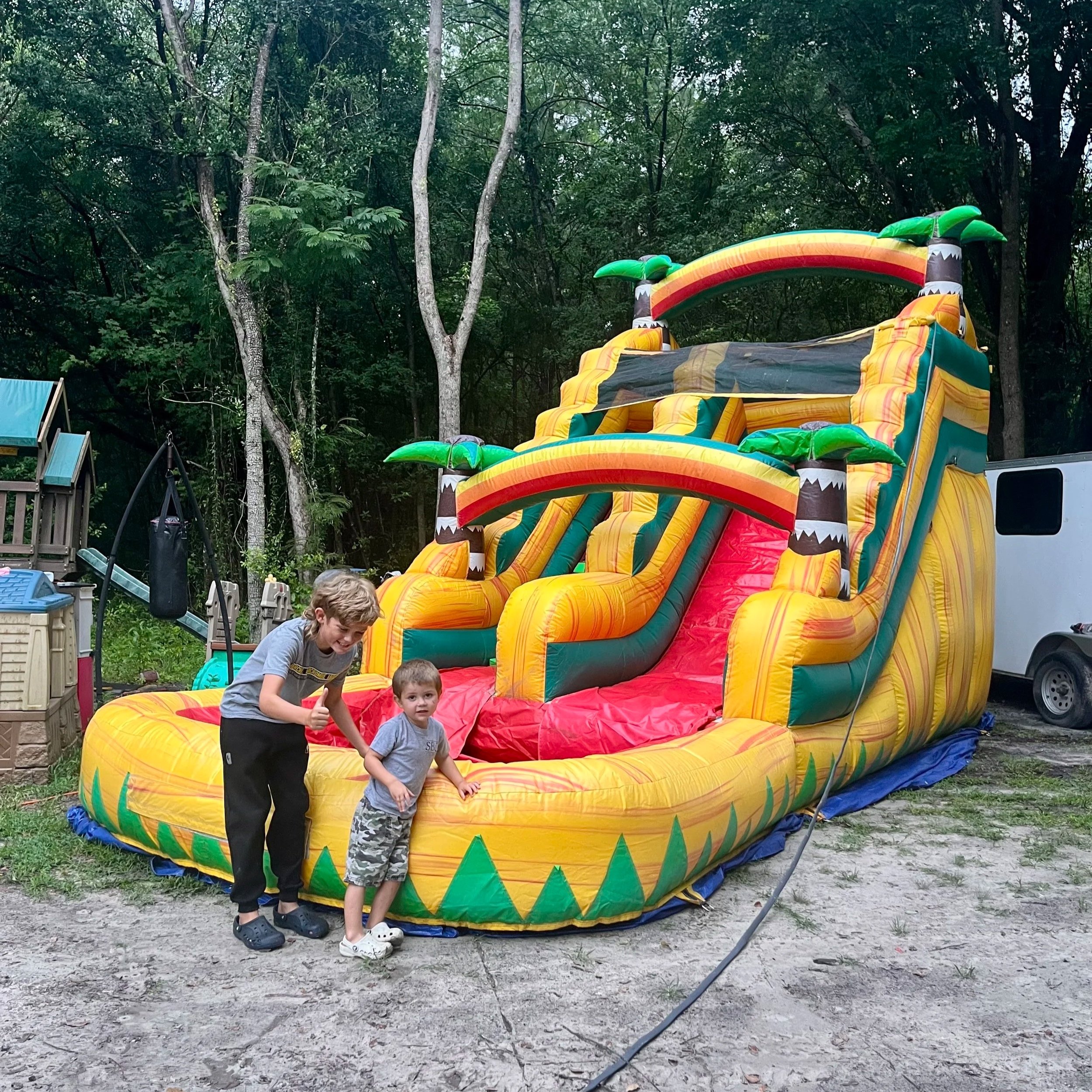 Sunshine Falls waterslide rental photographed on grass, suitable for residential yard setups.