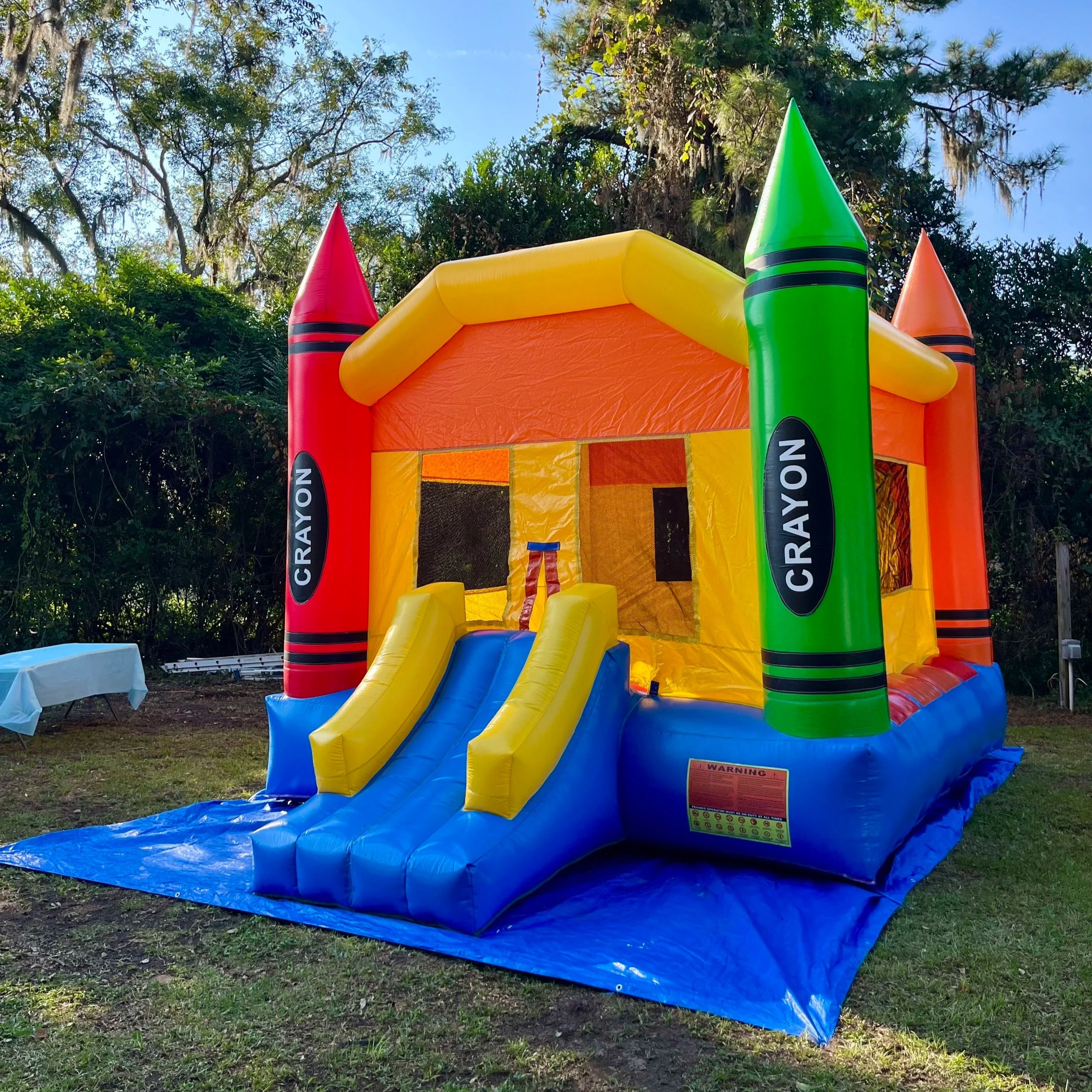 Colorful Crayon Castle bounce house designed for younger children.