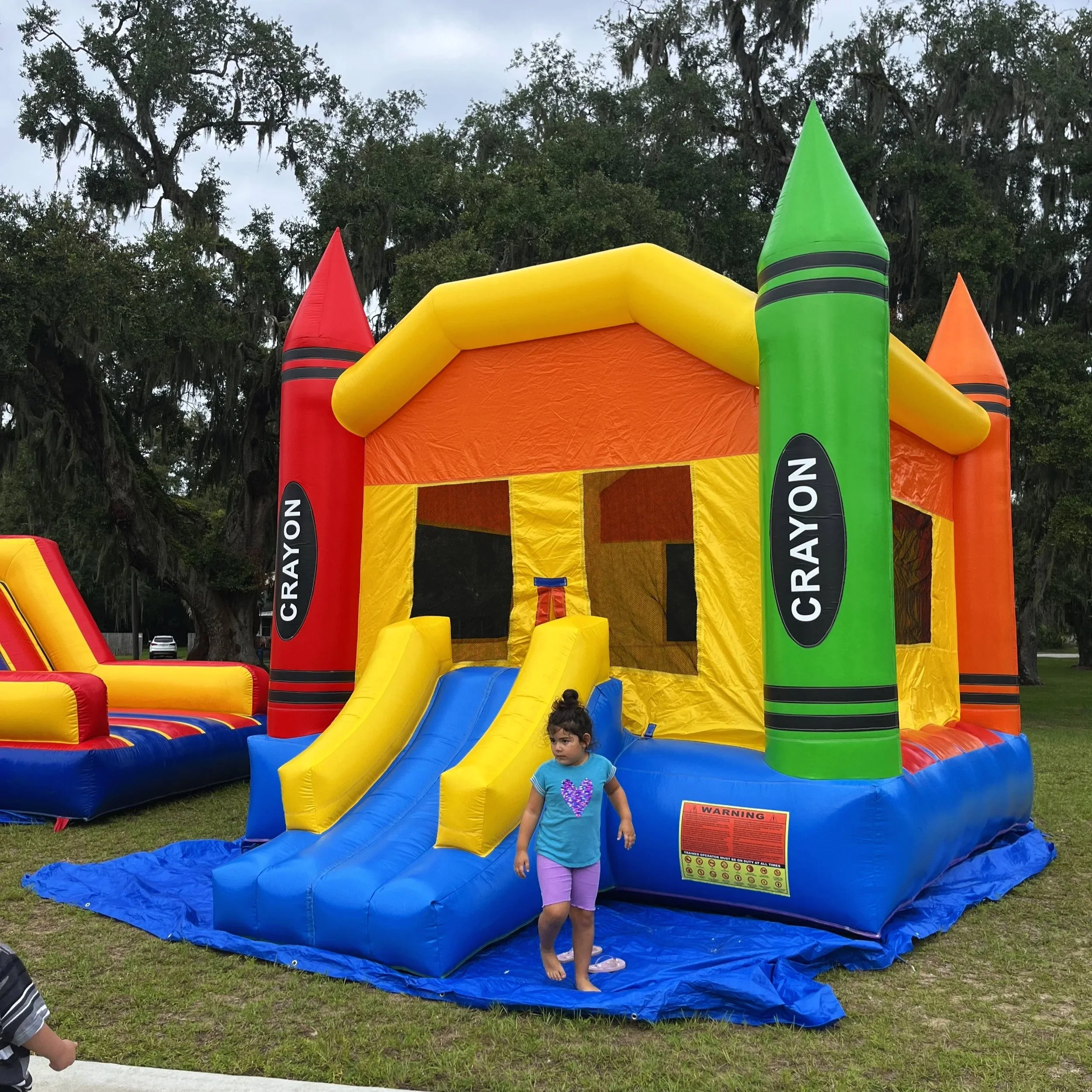Crayon Castle bounce house set up for a toddler birthday party in Brunswick, GA.
