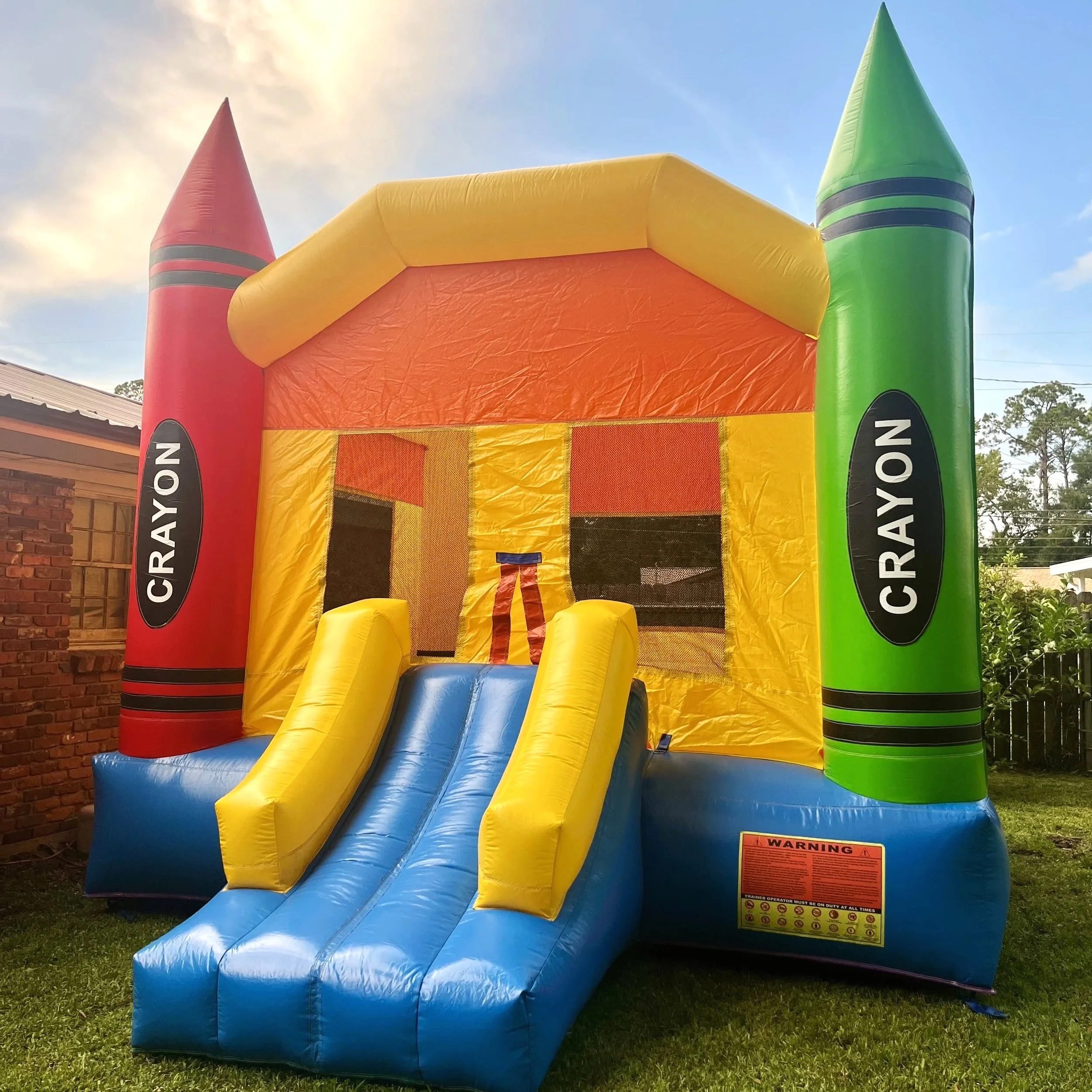 Crayon Castle bounce house set up for a toddler birthday party in Brunswick, GA.
