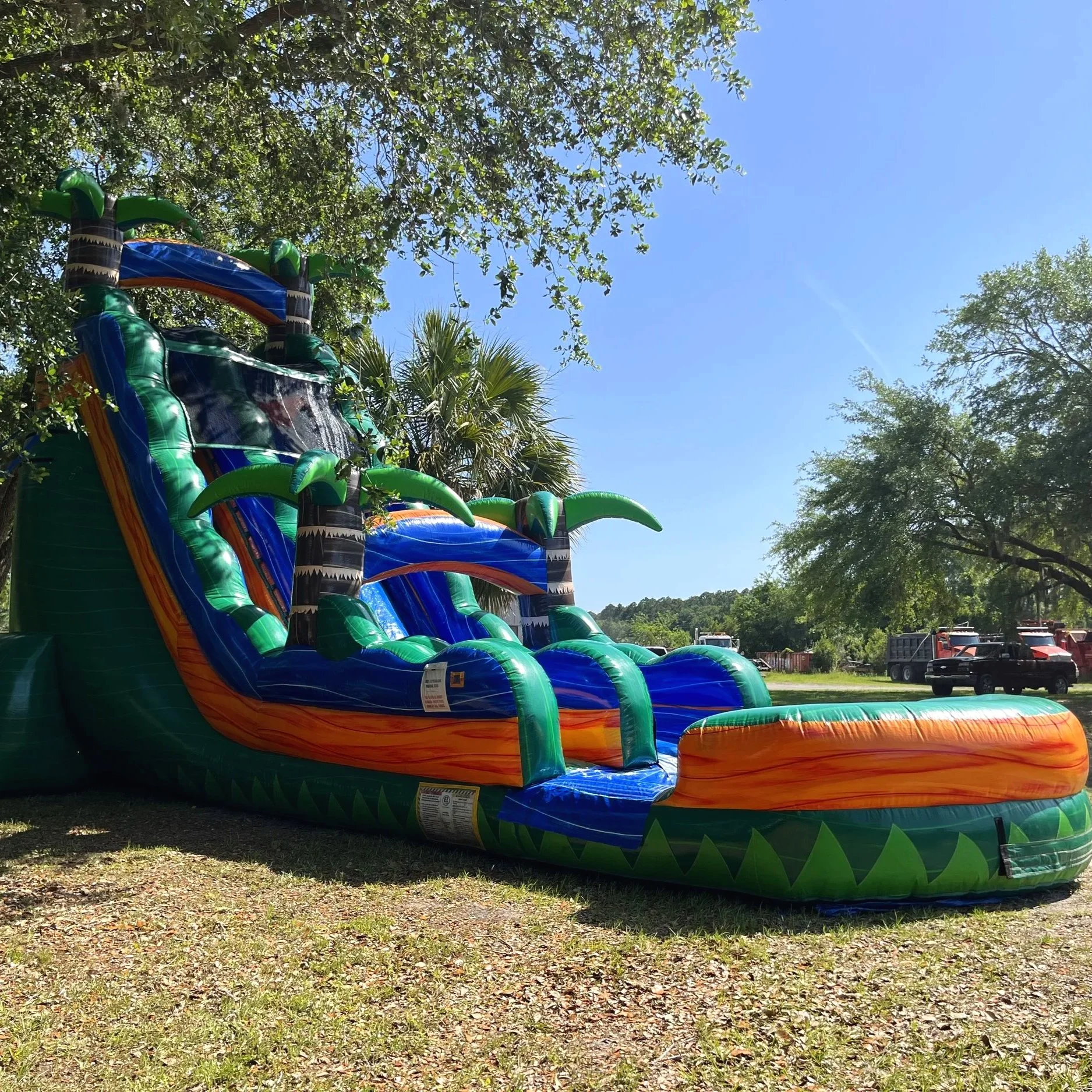 Commercial-grade inflatable water slide rental in Brunswick Georgia with safety side rails and wide climbing steps.