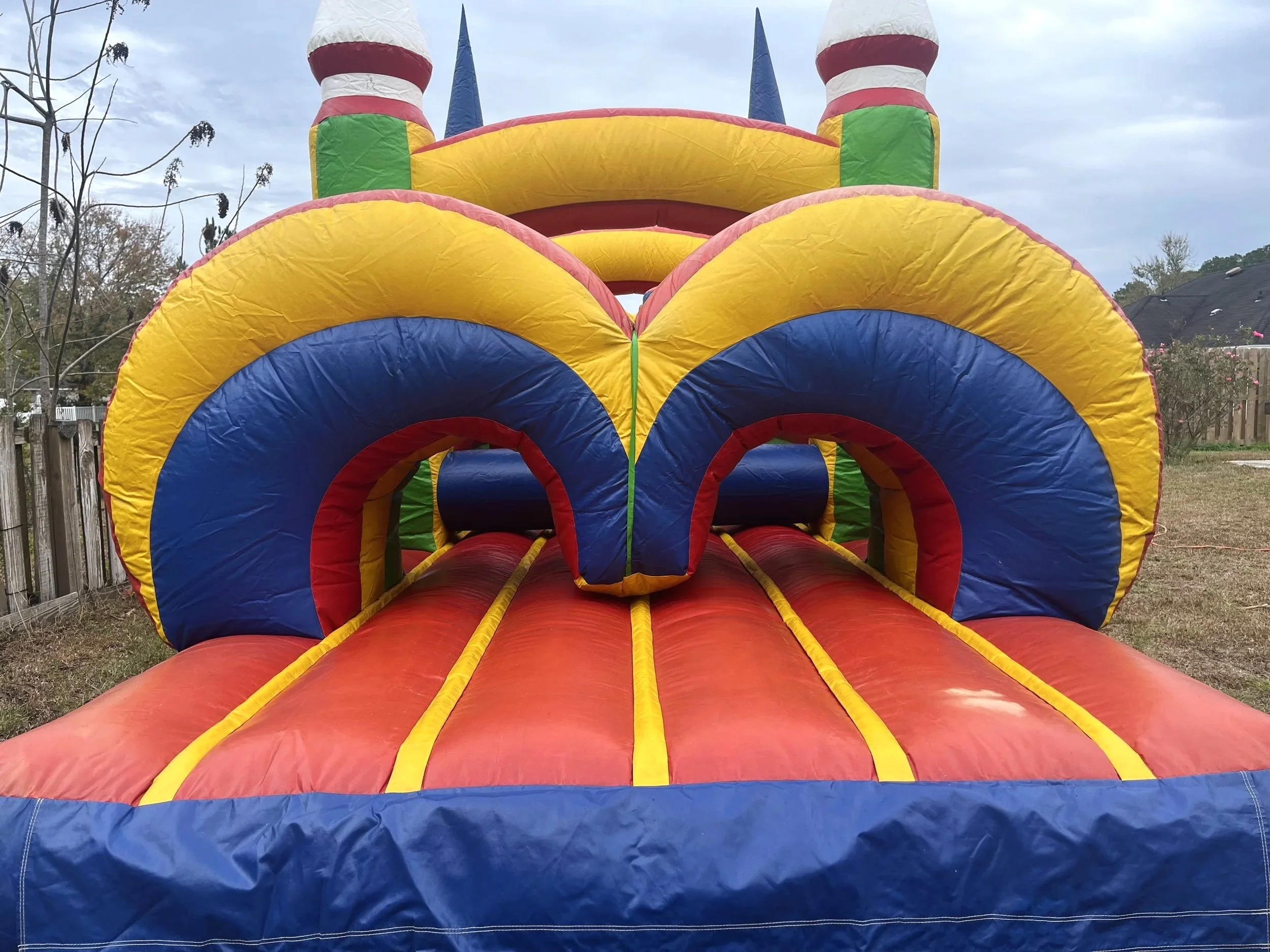 Compact inflatable obstacle course for toddlers and early elementary kids, ideal for small yards.