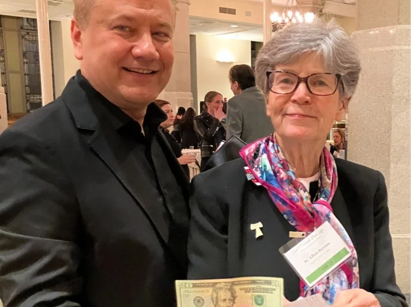 Two members of the LifeWay Network community, a man and a woman, at LifeWay Network's annual fundraising gala, the Event Towards New Life.