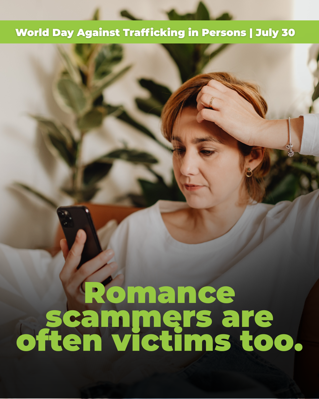 A middle aged woman looking at a cell phone