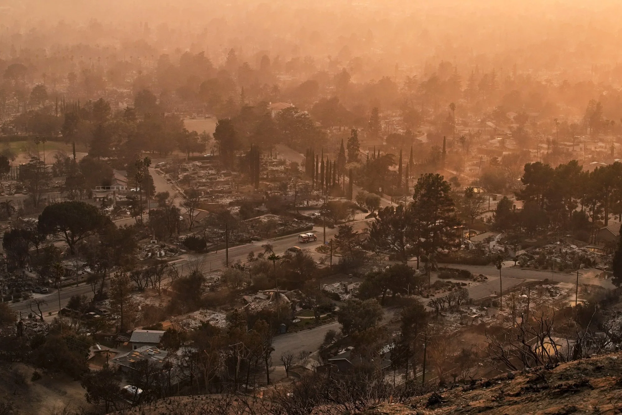 Aerial view of homes destroyed by the 2025 Eaton Fire in Altadena, California, showing wildfire devastation Airehart Construction addresses through expert witness cost-of-reconstruction and remediation estimates for homeowners and attorneys.