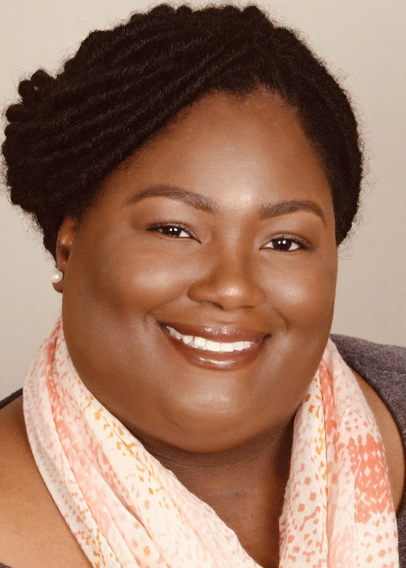 Smiling woman with a orange scard