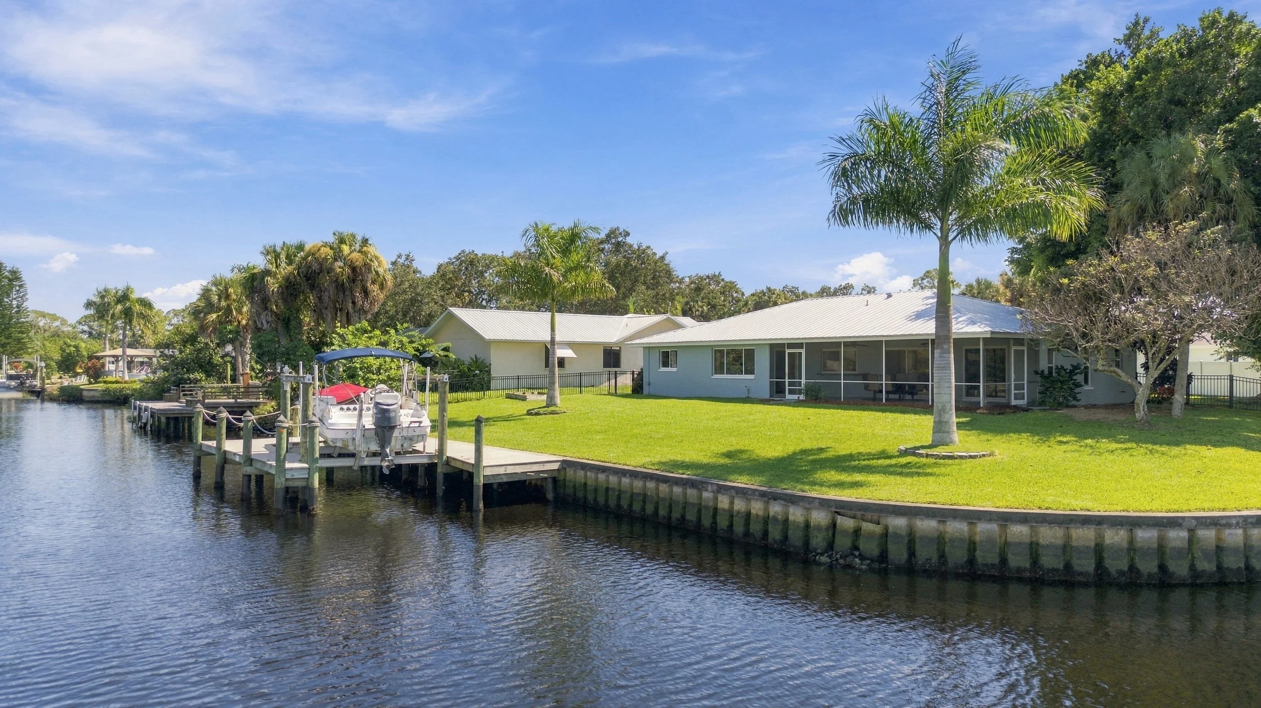 Aerial view of a canal lined with waterfront homes and docks