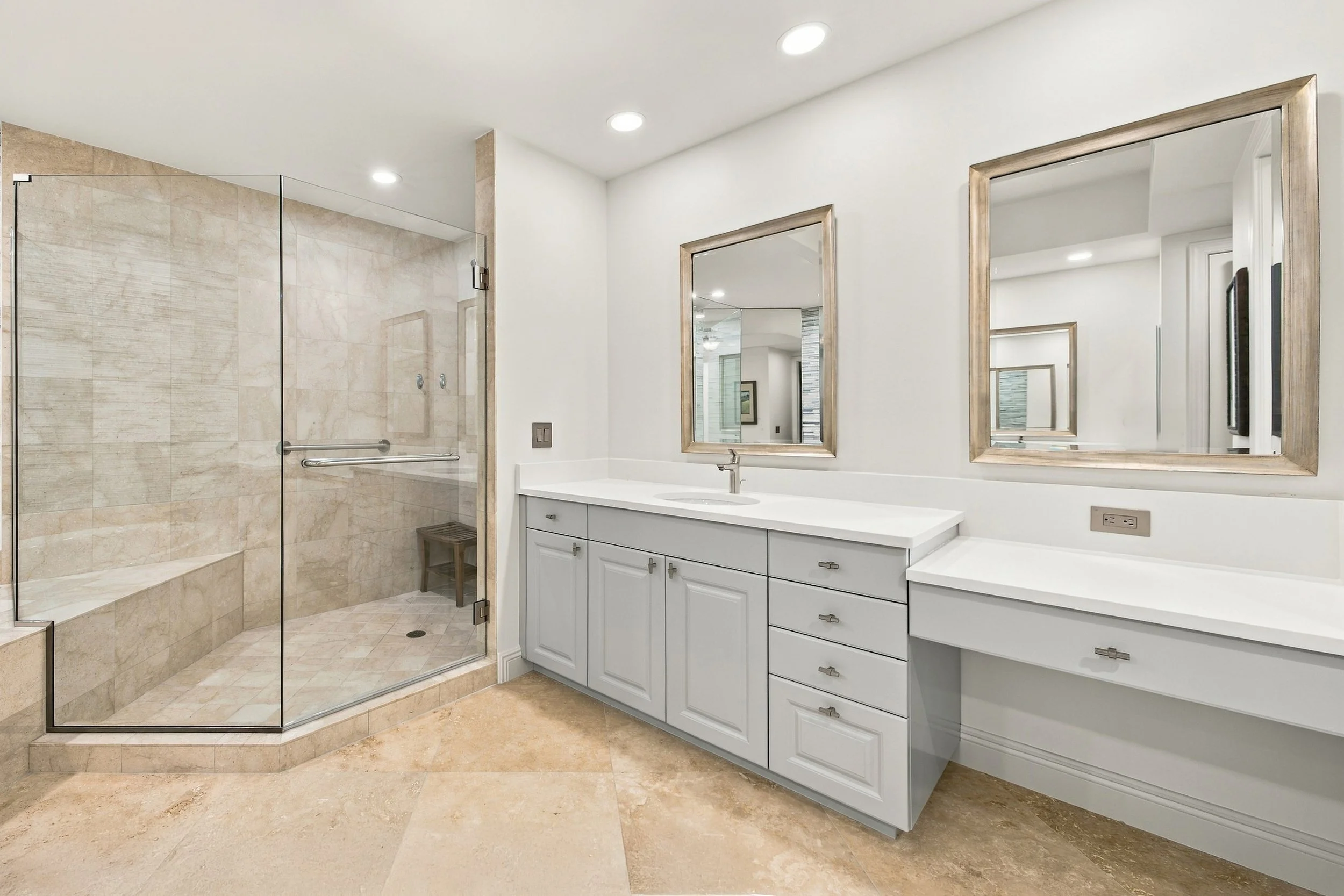 Bathroom with glass shower and double vanity