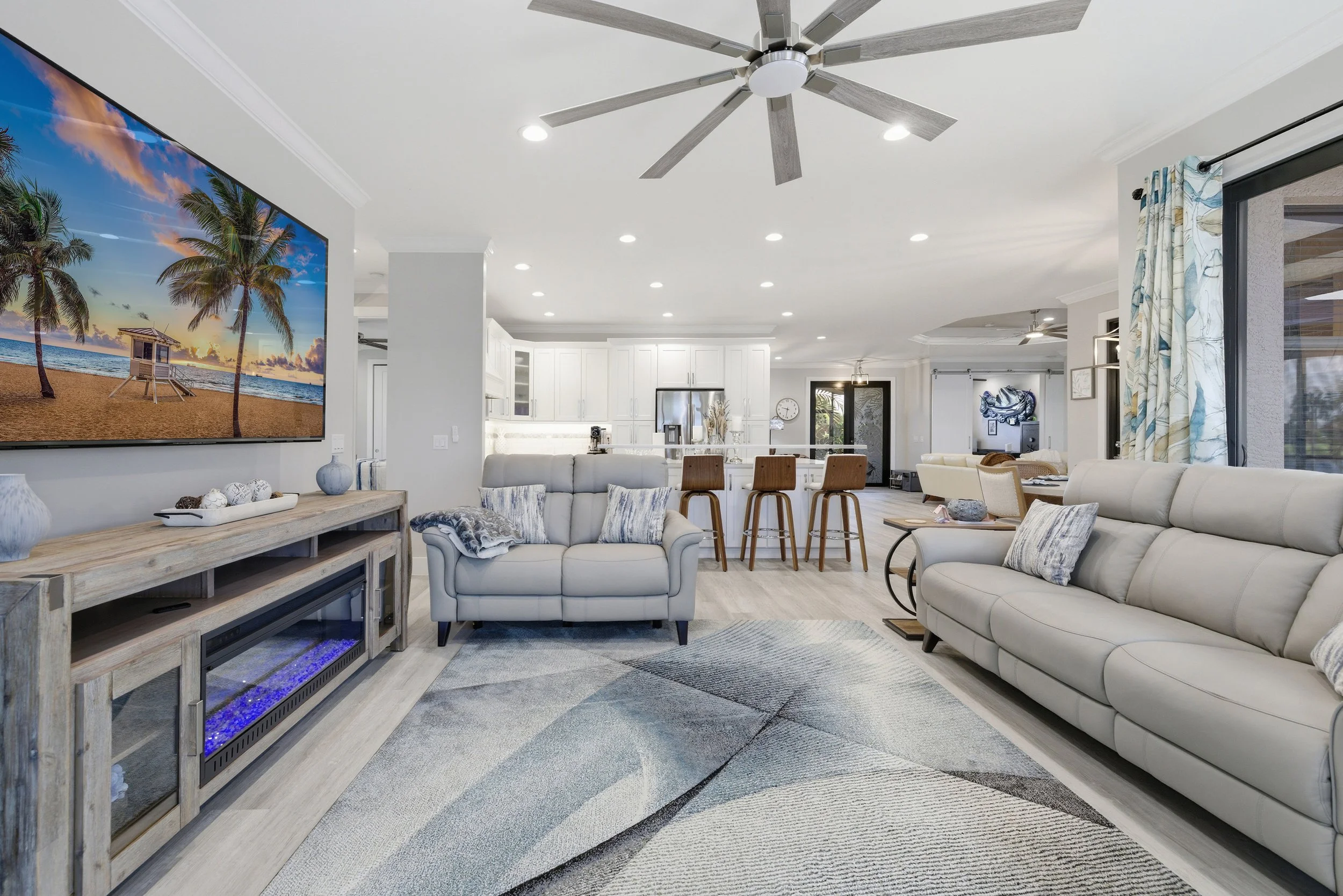 Family room with sectional sofa and wall-mounted TV