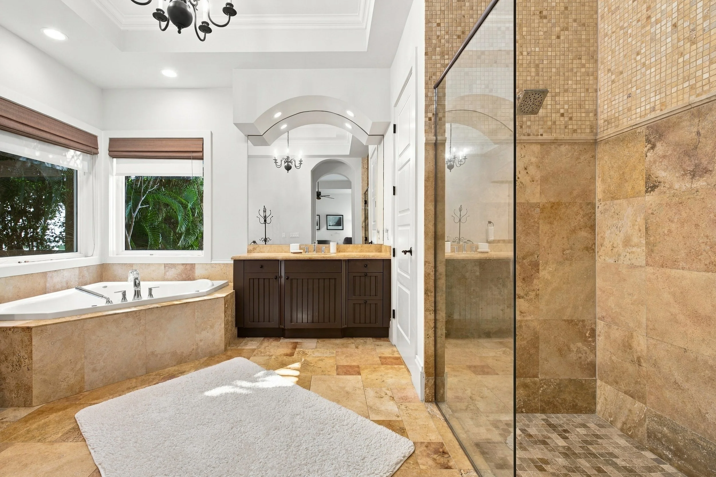 Primary bathroom with soaking tub and walk-in glass shower