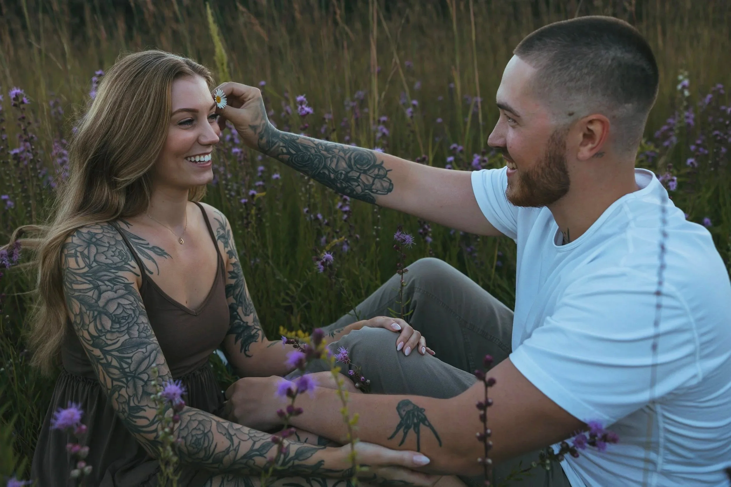 A couple sharing a close, candid moment during a lightly directed documentary style engagement photography session