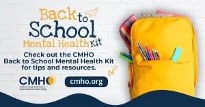 Back to school mental health kit with school supplies and a yellow backpack