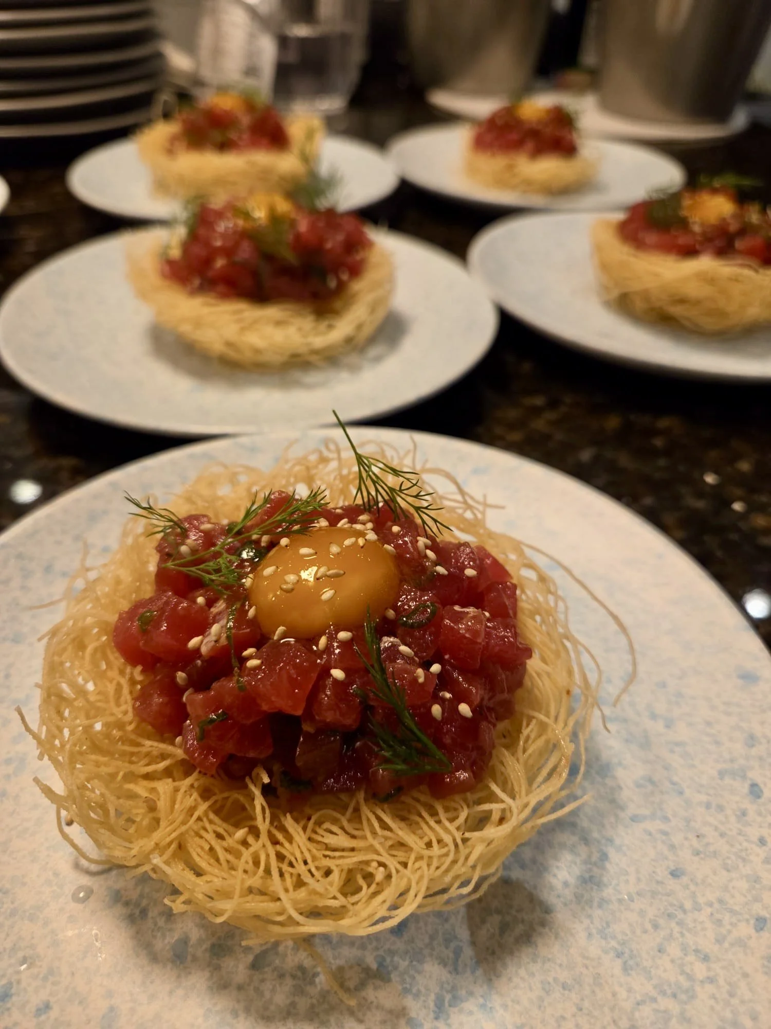 One of our renditions of our famous Bluefin Tuna Tartare. Bluefin is placed on a kataifi nest, marinated in rocoto, and plated with semi-cured quail egg. Bluefin is one of the most expensive fish in the world. With Delgado & Co, you know the quality 