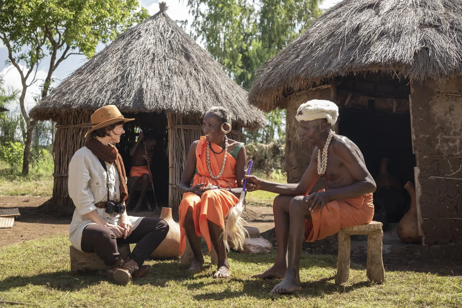 GIZ_Kenya_Sagana_Old_couple_conversing_with_tourist_by_hut_Photo_by_Joe_Kageni_0N3A5338.jpg