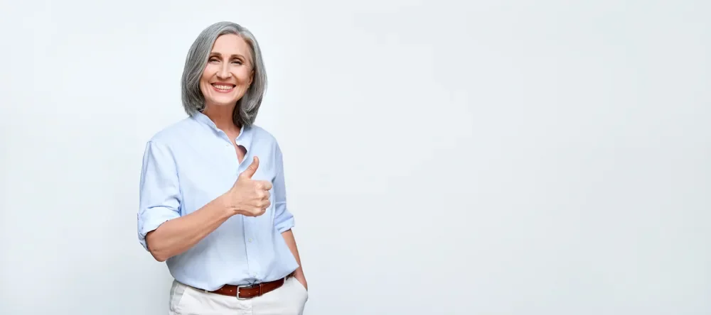 Mature caucasion lady with a thumbs up