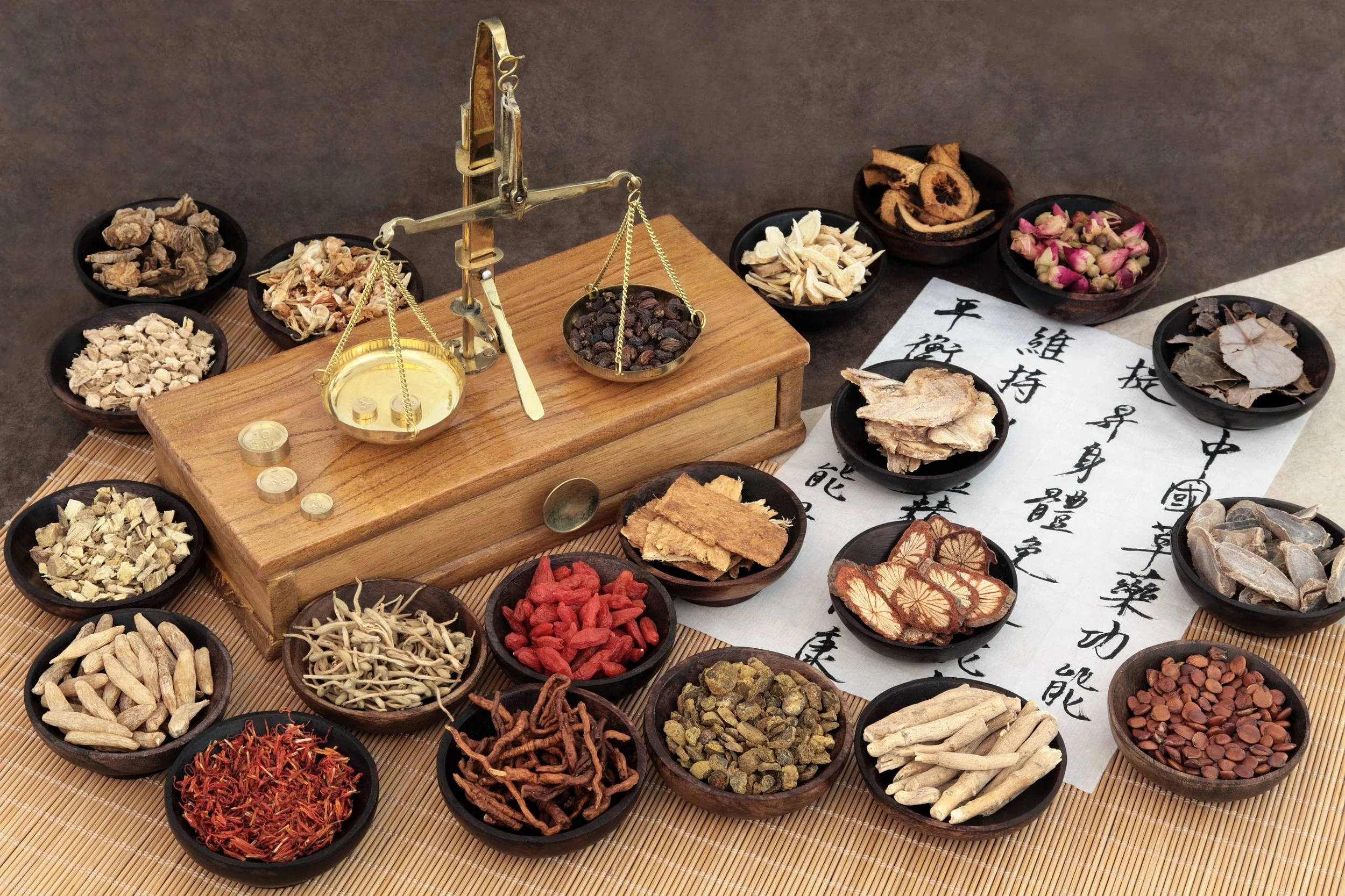 Assorted Chinese herbal granules and traditional scales used for personalised prescriptions in Brisbane