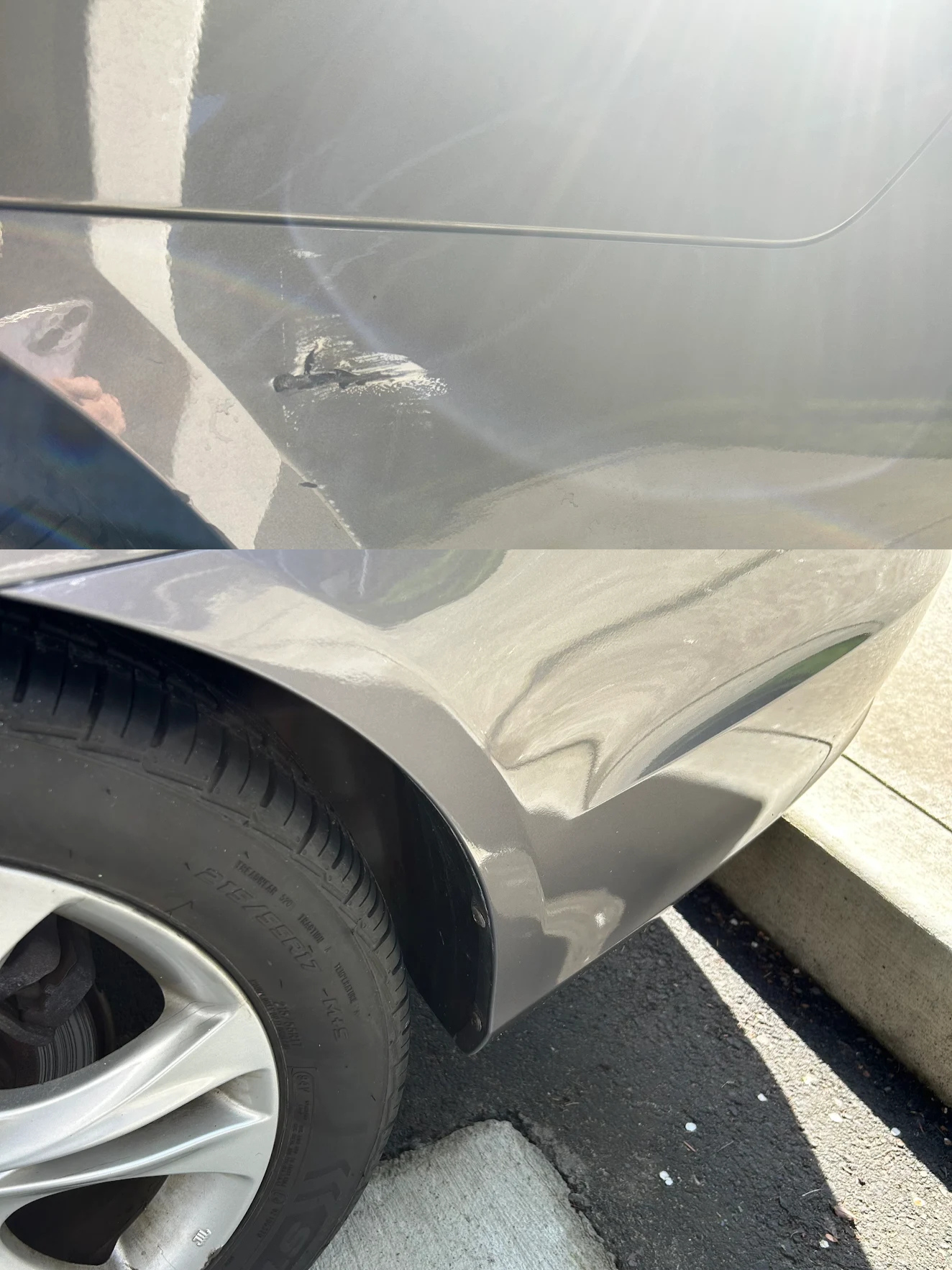 Close-up of a gray car's damaged rear fender and tire, with visible scratches and dents near the edge of the wheel well.