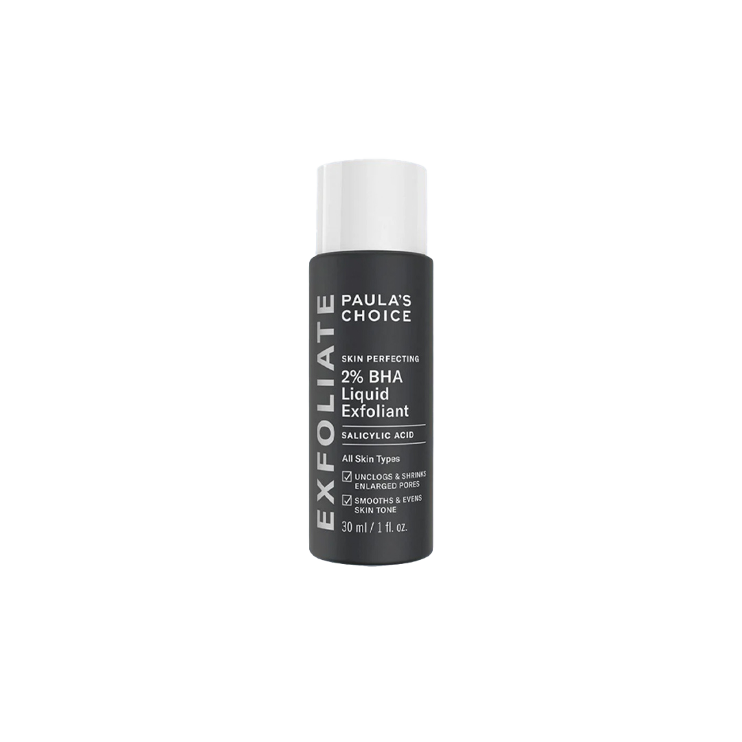 Black bottle of Paula's Choice 2% BHA Liquid Exfoliant with white text description and white cap placed on a white surface.
