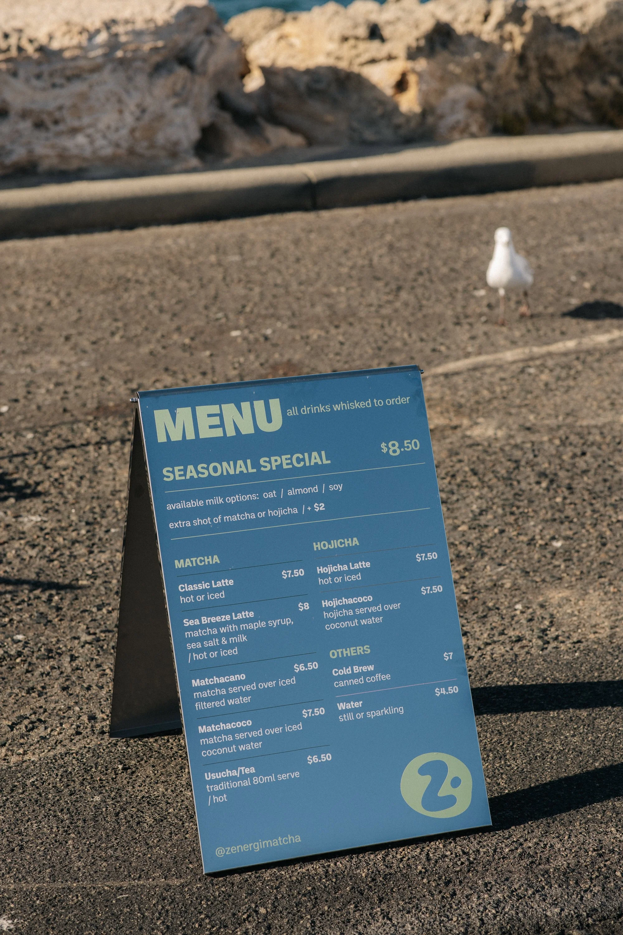 Zenergi Matcha. Vinyl cut decals, mirror silver a-frame signage.