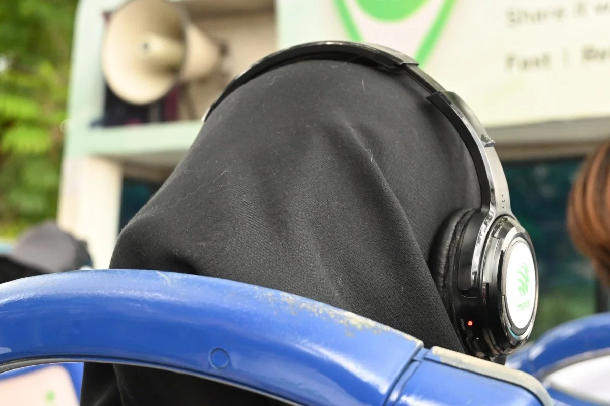 Passenger wearing Maxis-branded audio headphones