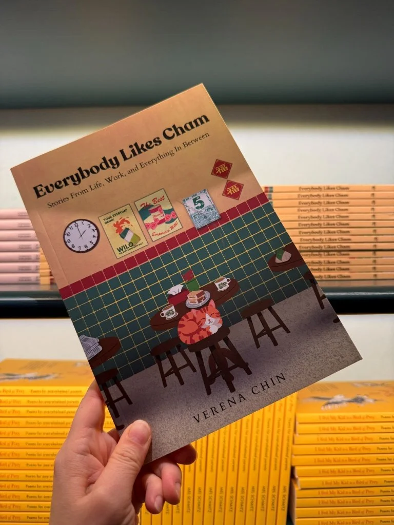 A copy of Everybody Likes Cham: Stories from Life, Work, and Everything in Between by Verena Chin on display