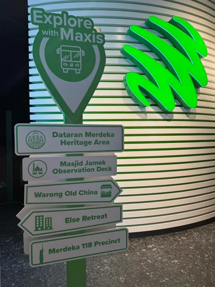 the five-destination signpost at Menara Maxis