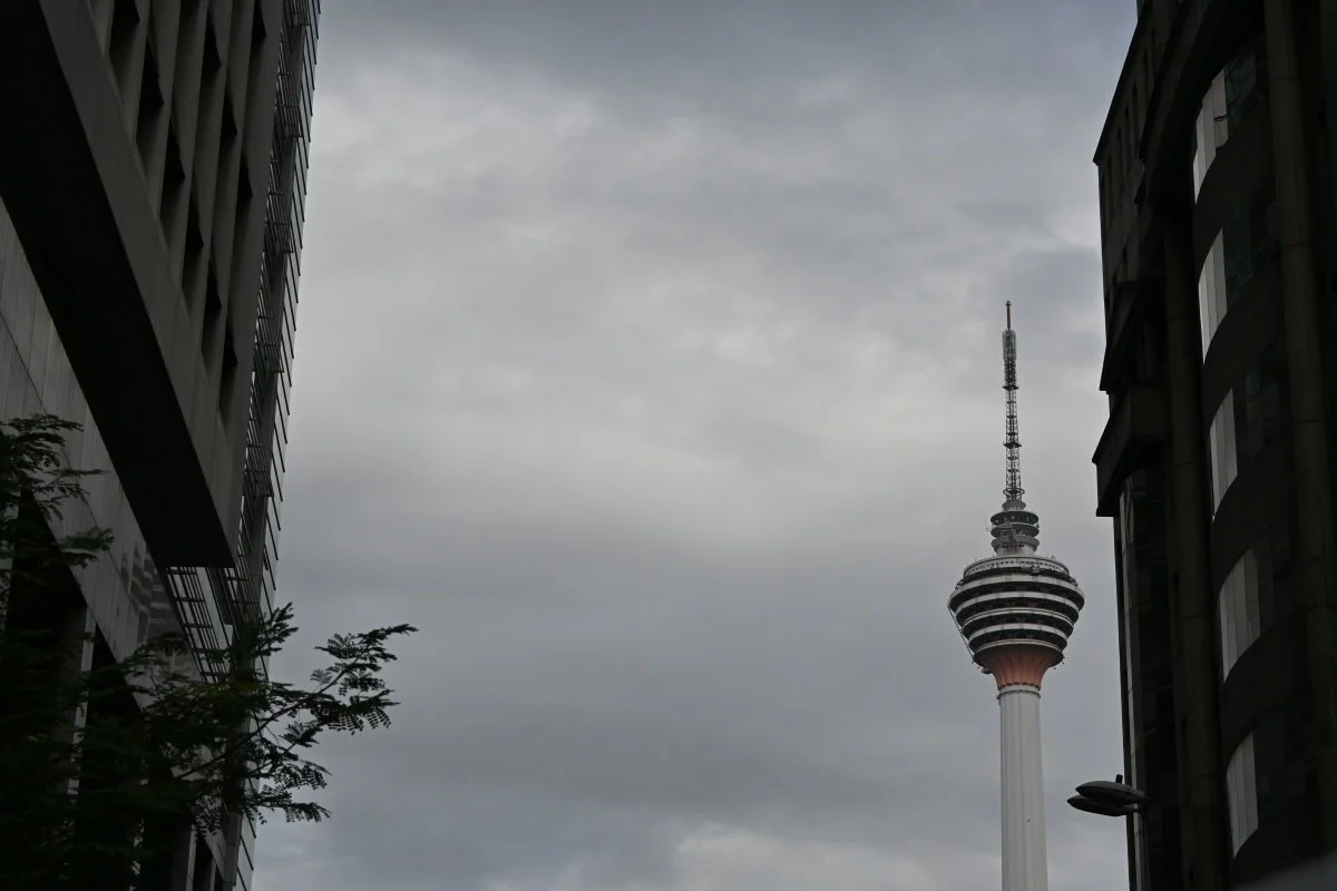 KL Tower framed between buildings