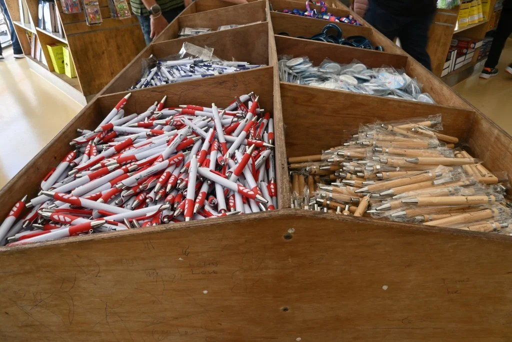 oulos Hope branded pens stationery wooden bins merchandise