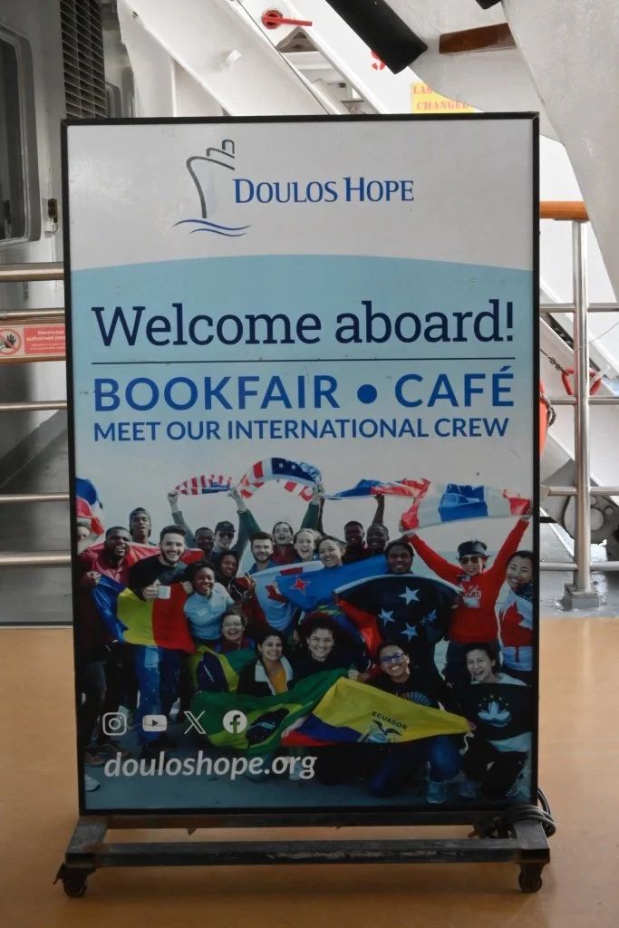 Doulos Hope welcome aboard bookfair cafe international crew sign