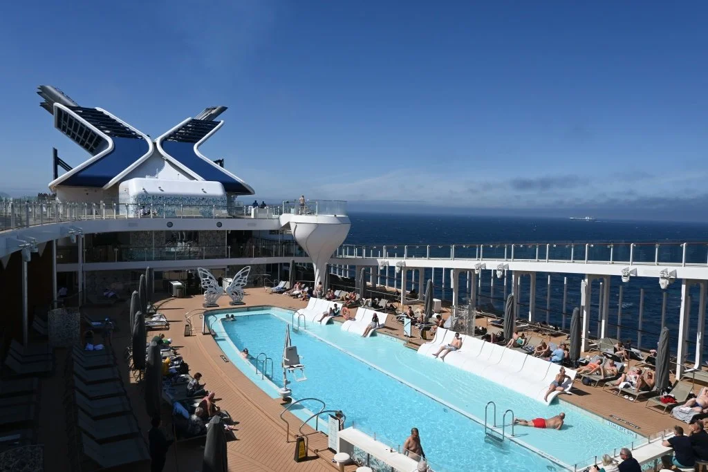 Top deck of Celebrity Edge cruise ship with pool and ocean views