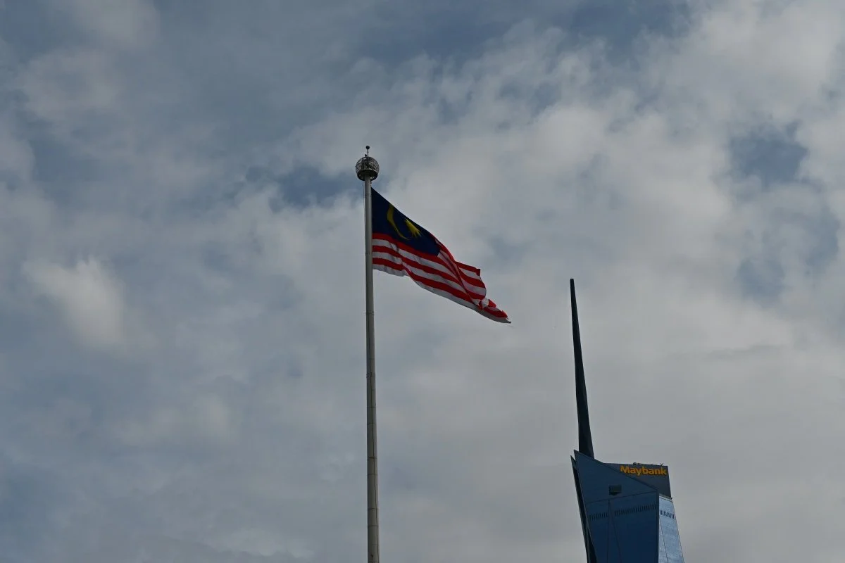 Malaysian flag and KL cityscape