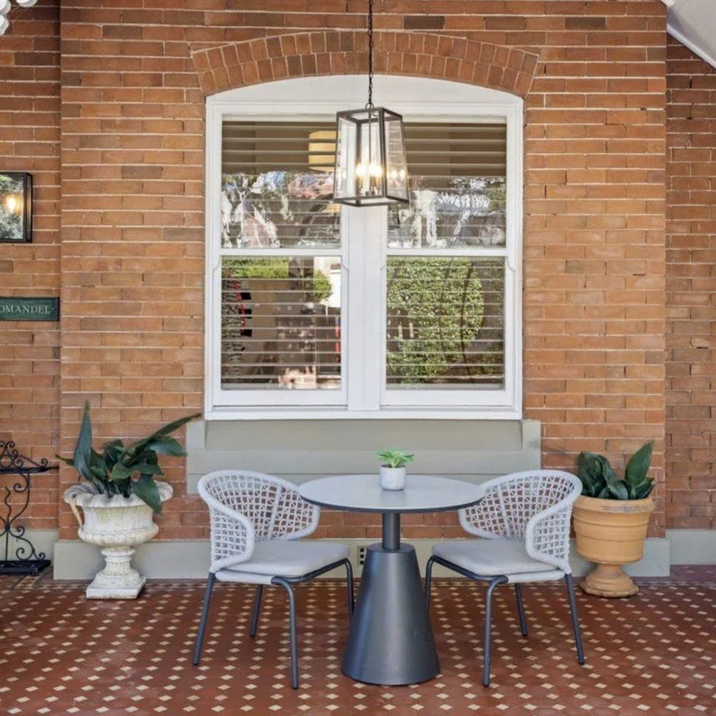 Original verandah with tessellated tiles and an arched brick window on a Federation home, Mosman