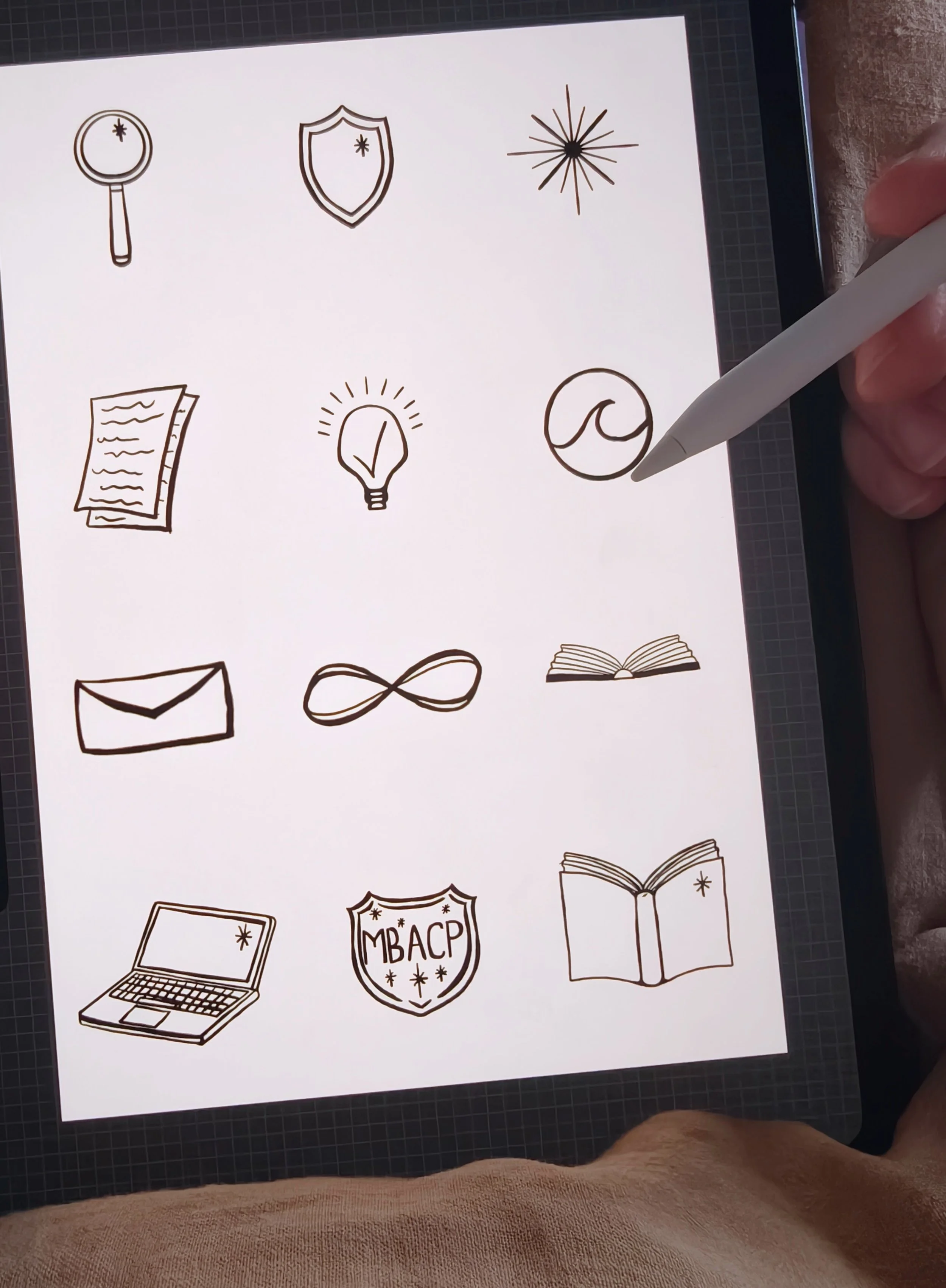 Collection of hand-drawn black and white icons including a magnifying glass, shield, starburst, sheet of paper, lightbulb, wave, laptop, MDACP shield, and open book.