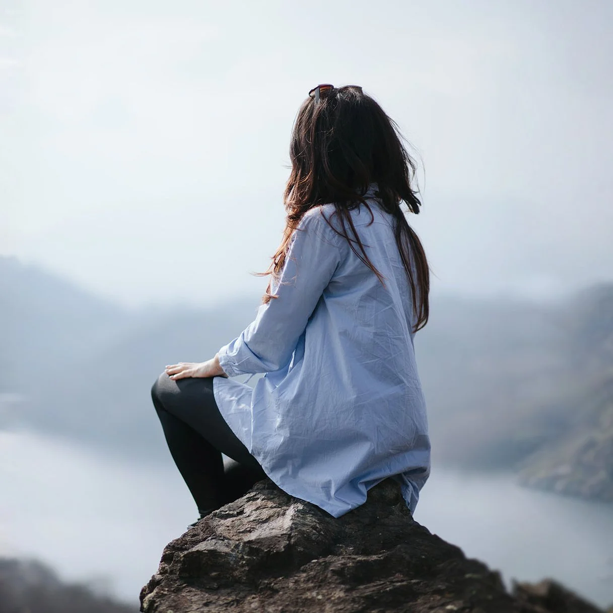 Woman on mountain top