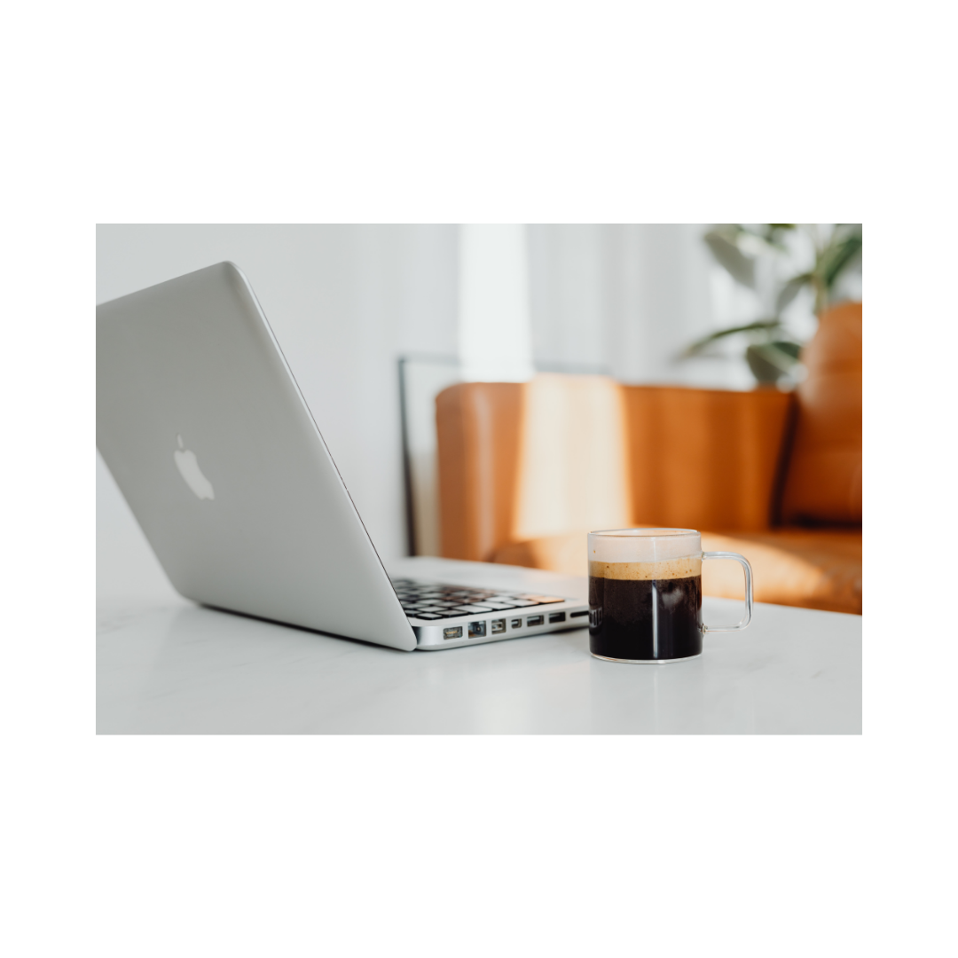 laptop on desk with coffee