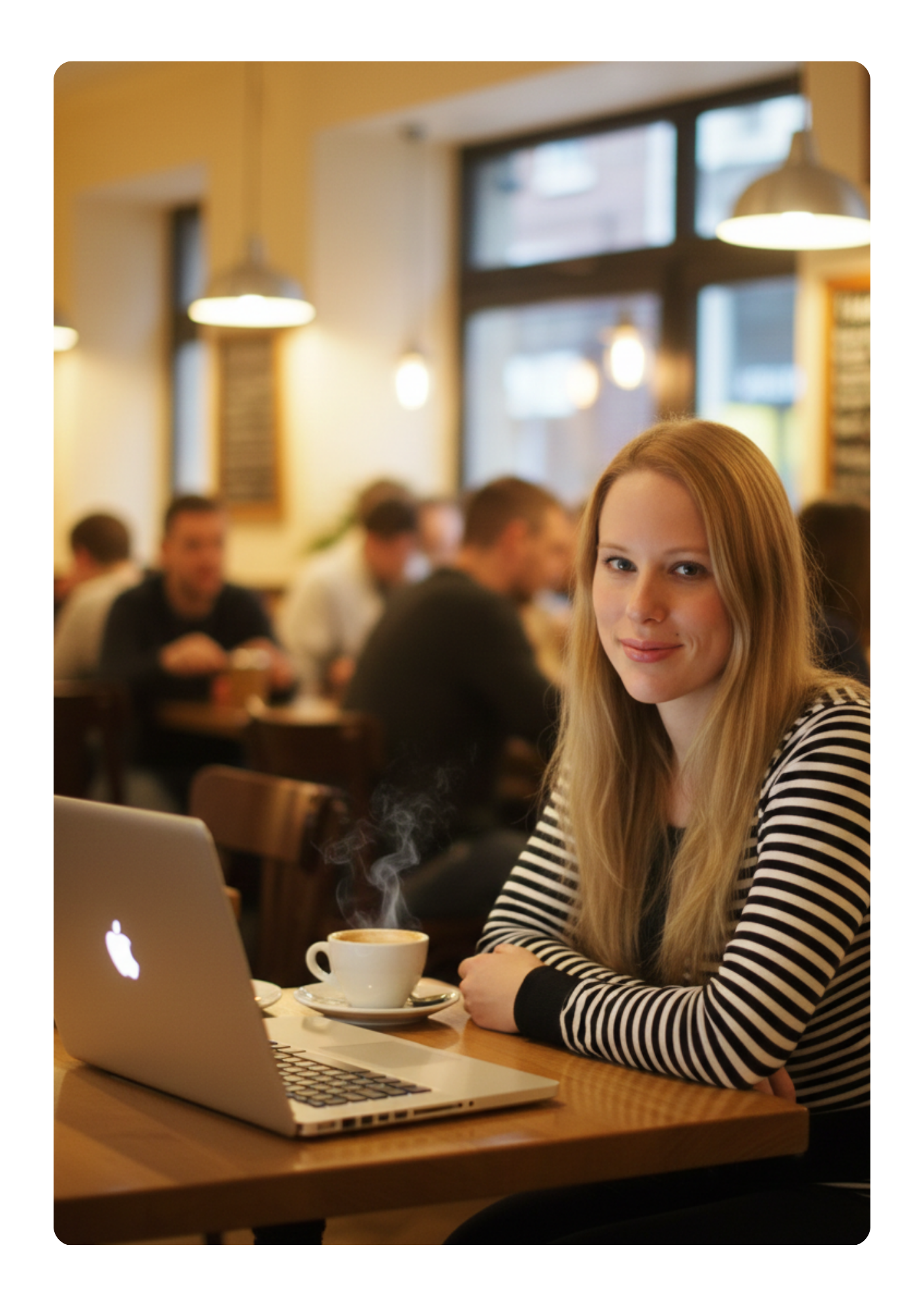 hannahn oneill sitting in cafe with laptop