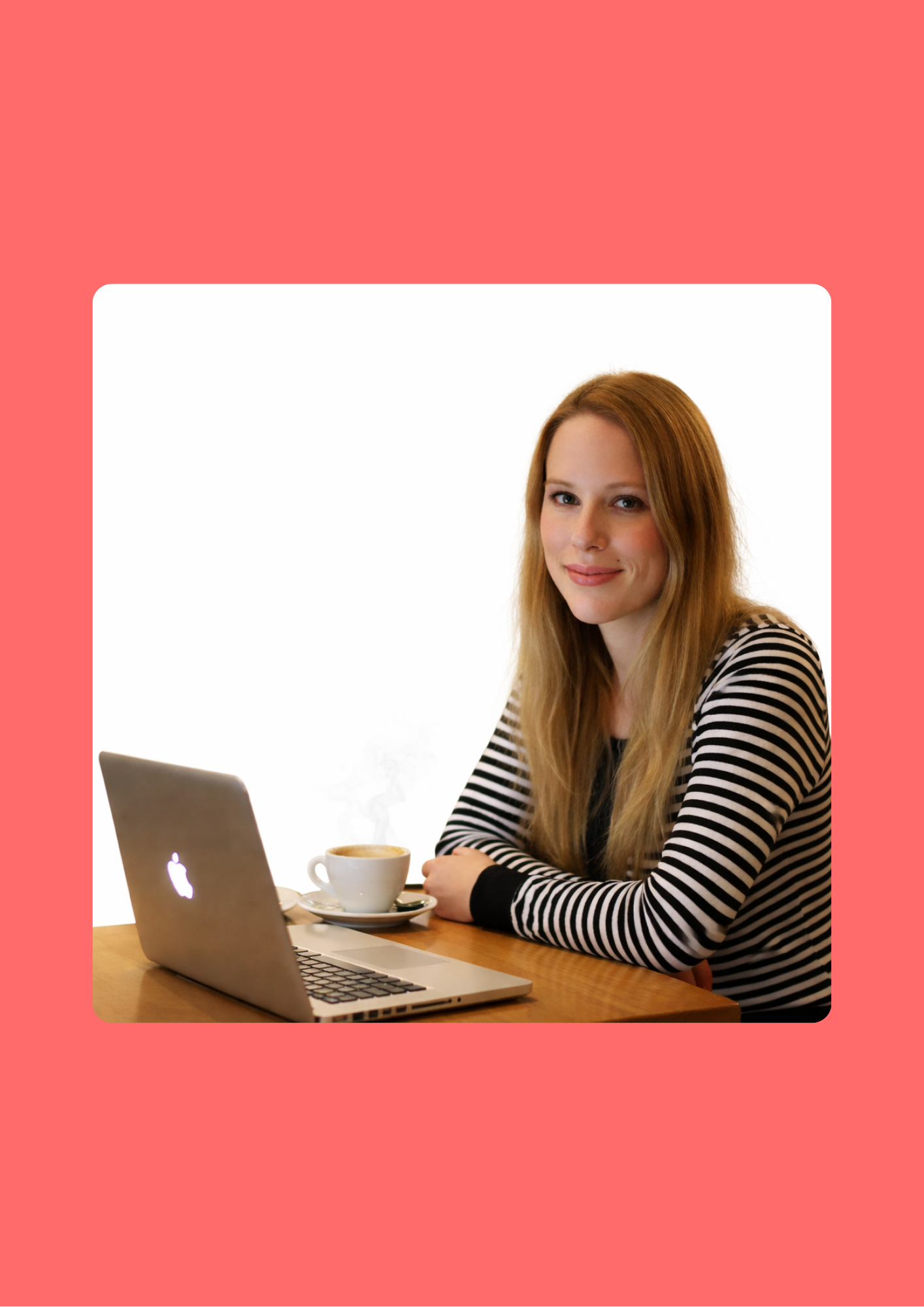 Hannah Oneill sitting in a cafe with a laptop and coral background