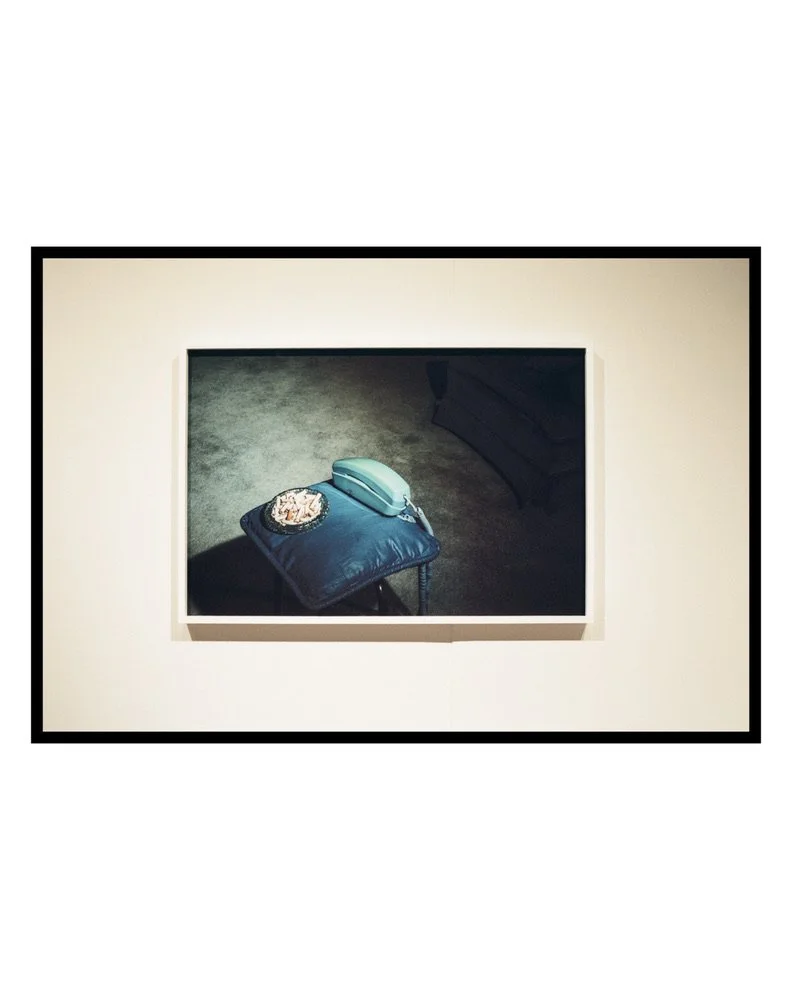 Framed photograph by Emily Zōe displayed on a gallery wall.